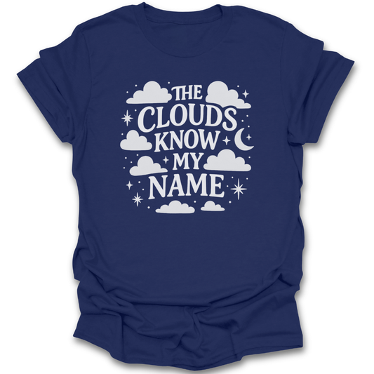 Navy blue t-shirt with white clouds know my name design and text on a white background