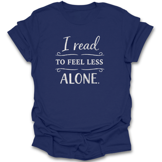 Navy blue t-shirt with white text 'I read to feel less alone' on a white background book reading literary t shirt