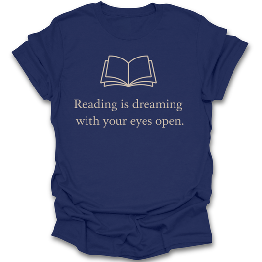 Navy blue t-shirt with white text and book illustration on a white background reading is dreaming with your eyes open t shirt