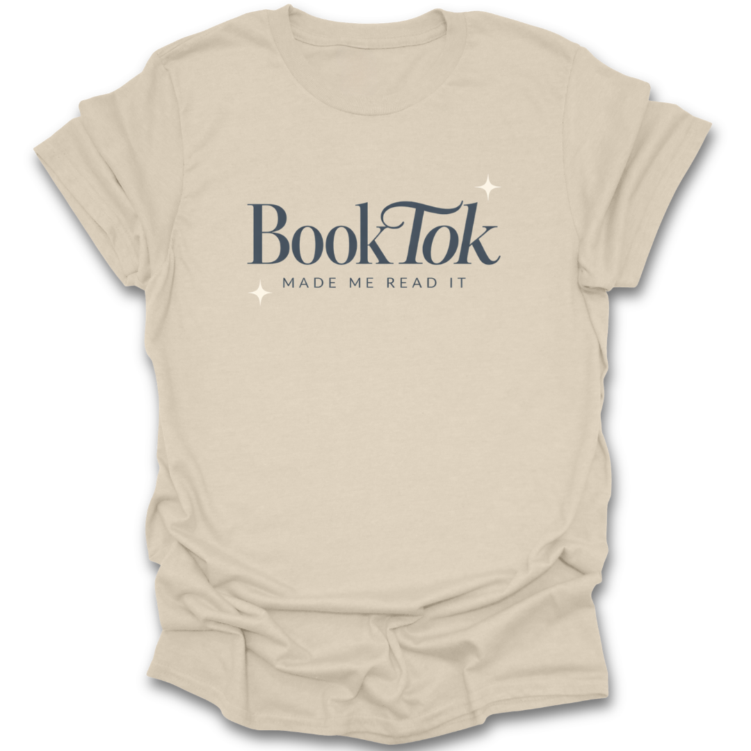 Beige t-shirt with 'BookTok Made Me Read It' text on a white background funny book reading literary t shirt