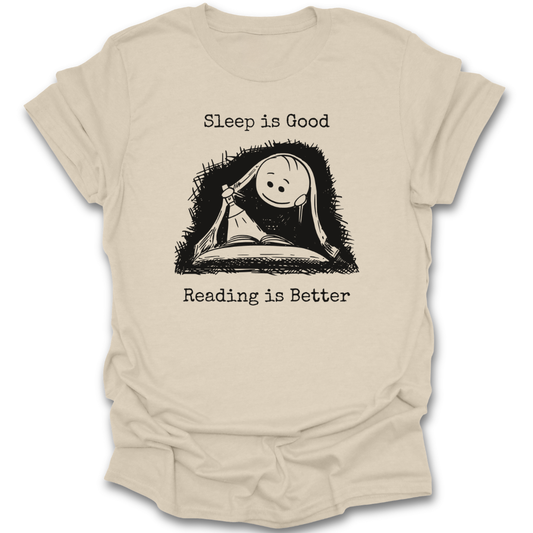 Beige t-shirt with a graphic of a book and sleeping face, text 'Sleep is Good Reading is Better' on a white background. cute  funny book reading literary t shirt