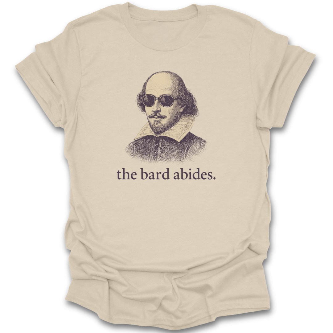 Beige t-shirt with a graphic of Shakespeare wearing sunglasses and the text 'the bard abides' on a white background. funny book reading literary t shirt