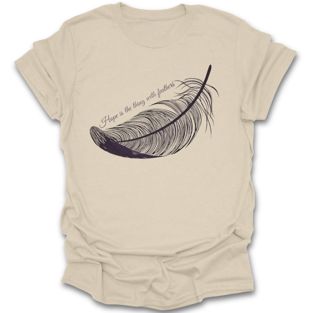 Beige t-shirt with a feather graphic and text on a white background Emily Dickinson shirt, hope is the thing with feathers shirt, poetry lover shirt, literary quote shirt, bookish shirt, poet shirt, English teacher gift, librarian gift, dark academia shirt, book lover gift.&nbsp;