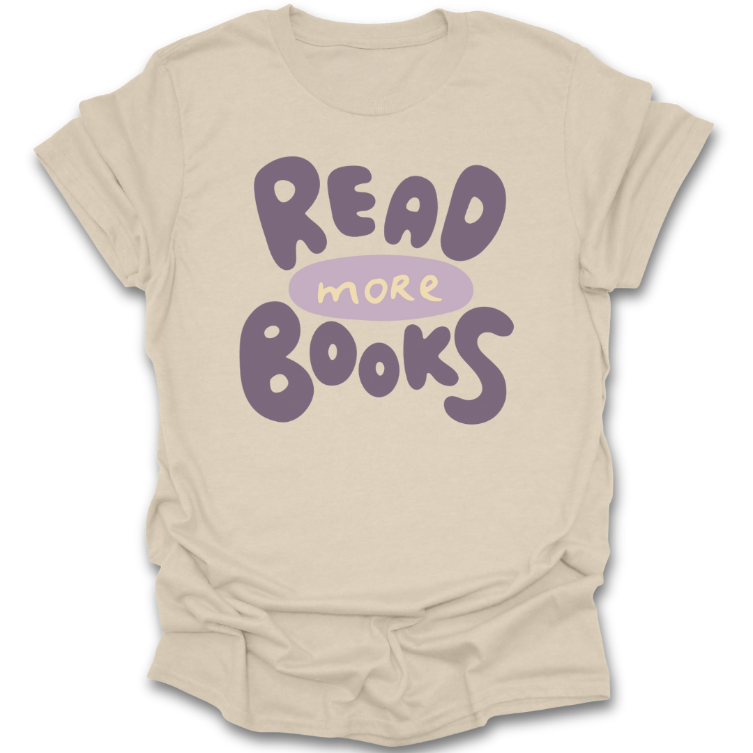 Beige t-shirt with 'Read More Books' text in purple on a white background literary t shirt