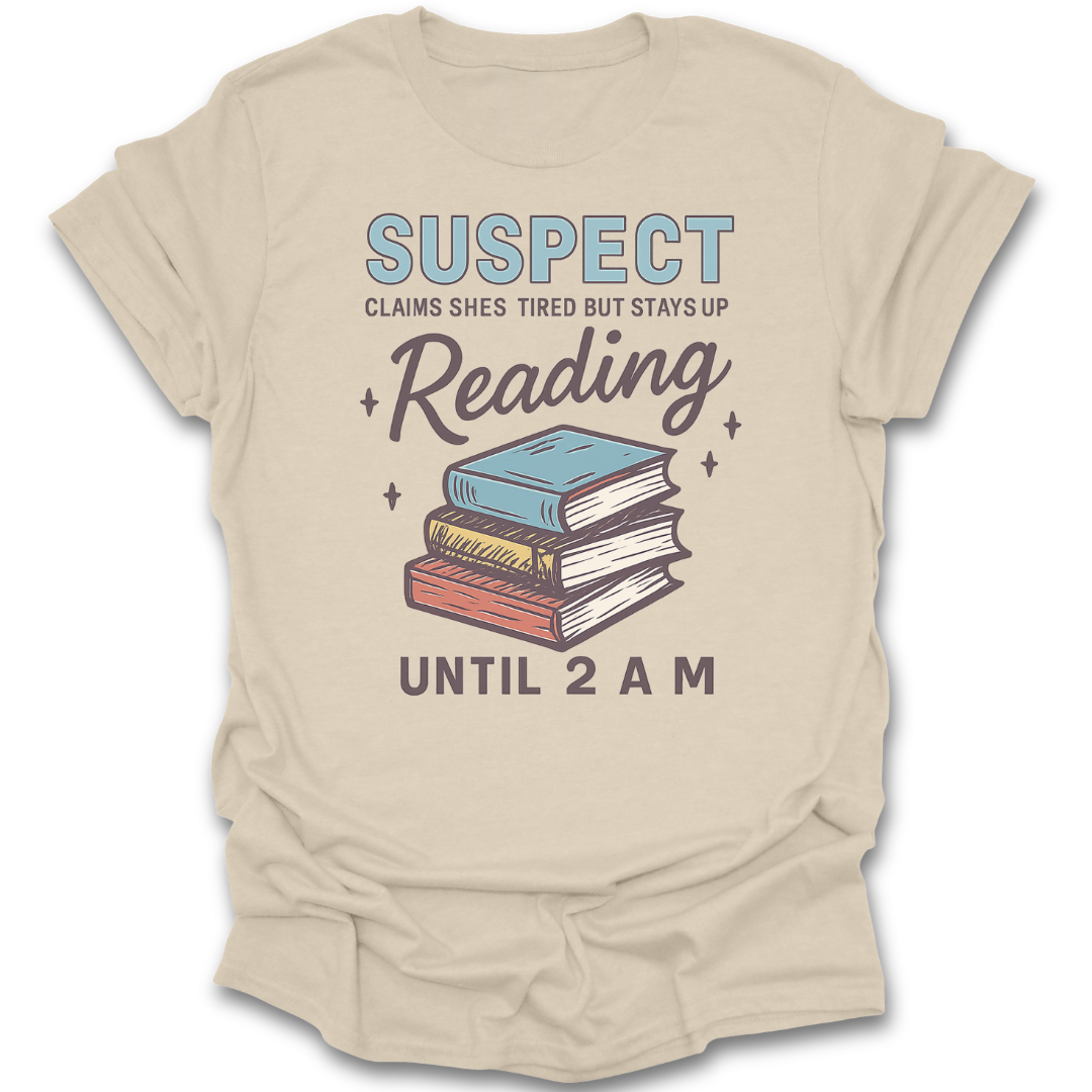 Beige t-shirt with book graphic and text on a white background  funny book reading literary t shirt crime mystery