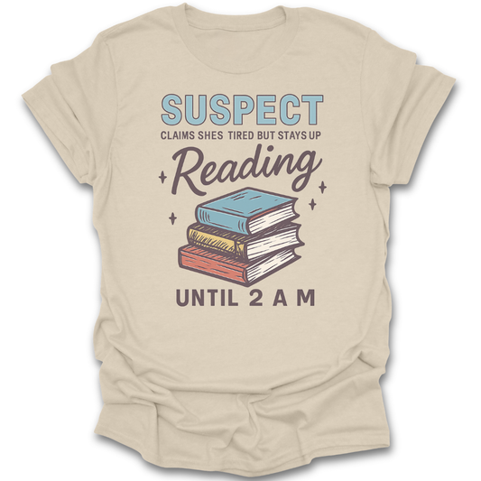 Beige t-shirt with book graphic and text on a white background  funny book reading literary t shirt crime mystery