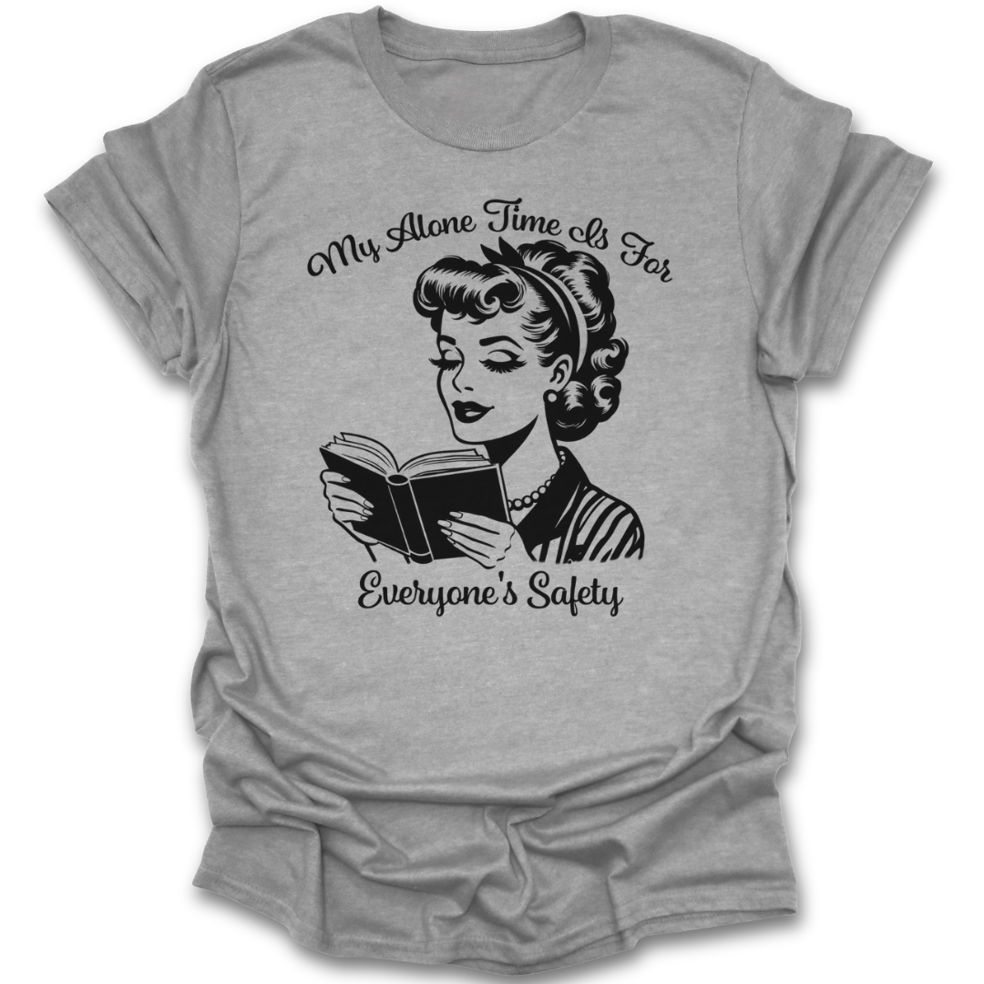 Gray t-shirt with a graphic of a woman reading a book and text 'My Alone Time Is For Everyone's Safety' on a white background. book t shirt