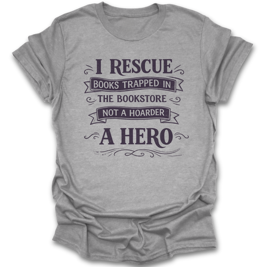 Gray t-shirt with text 'I Rescue Books Trapped in the Bookstore Not a Hoarder, A Hero' on a white background funny book reading literary t shirt