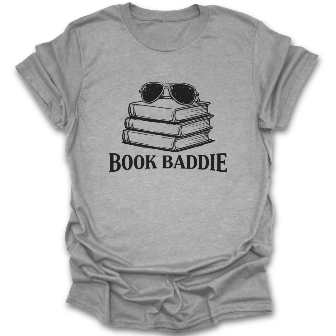 Gray t-shirt with 'Book Baddie' graphic and stack of books and sunglasses on a white background funny book reading literary t shirt