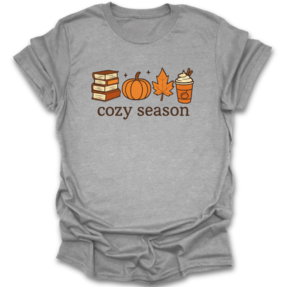 Gray t-shirt with autumn-themed graphics and 'cozy season' text on a white background cozy book reading literary t shirt